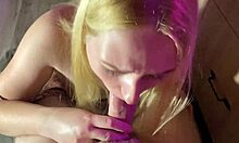 A blonde housewife gives a sensual blowjob while cooking in the kitchen