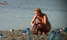 Blonde beauty on sandy shore